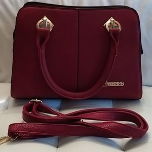 Red faux leather hand vag